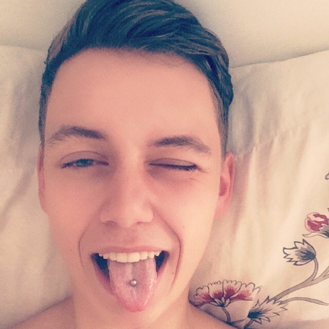 Male tongue piercing