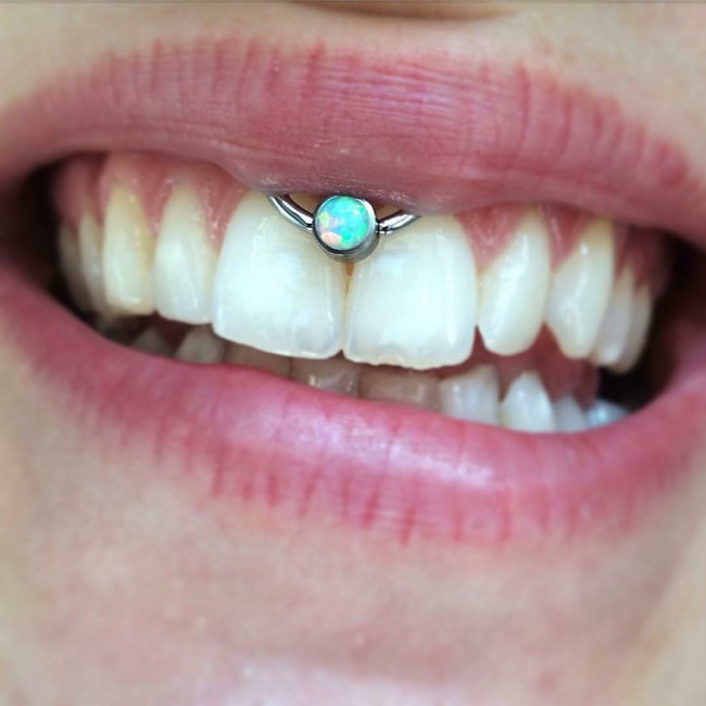 smiley upper lip piercing image