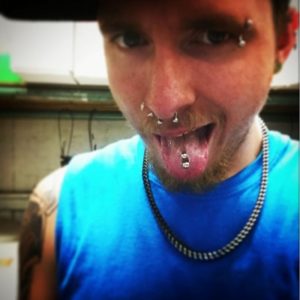 Piercing male tongue 