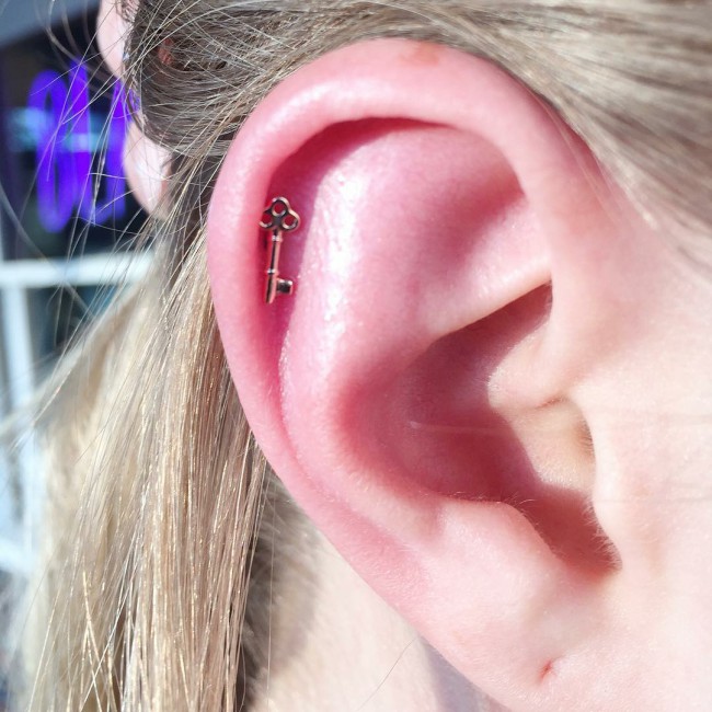 Helix piercing: pain, healing, jewelry - obsidian piercing