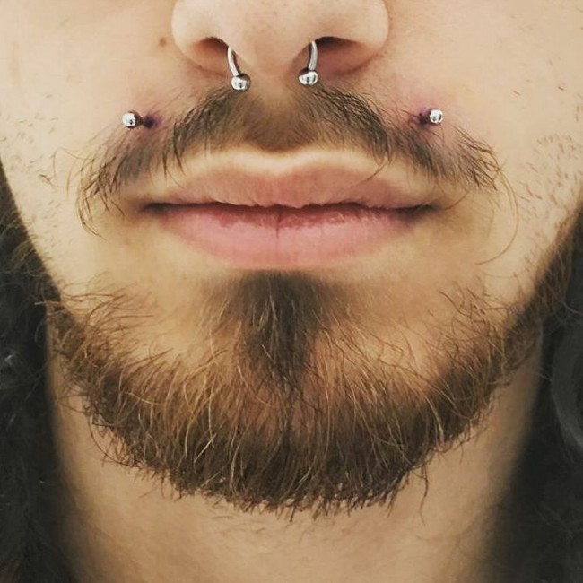 angel bites piercing on guy