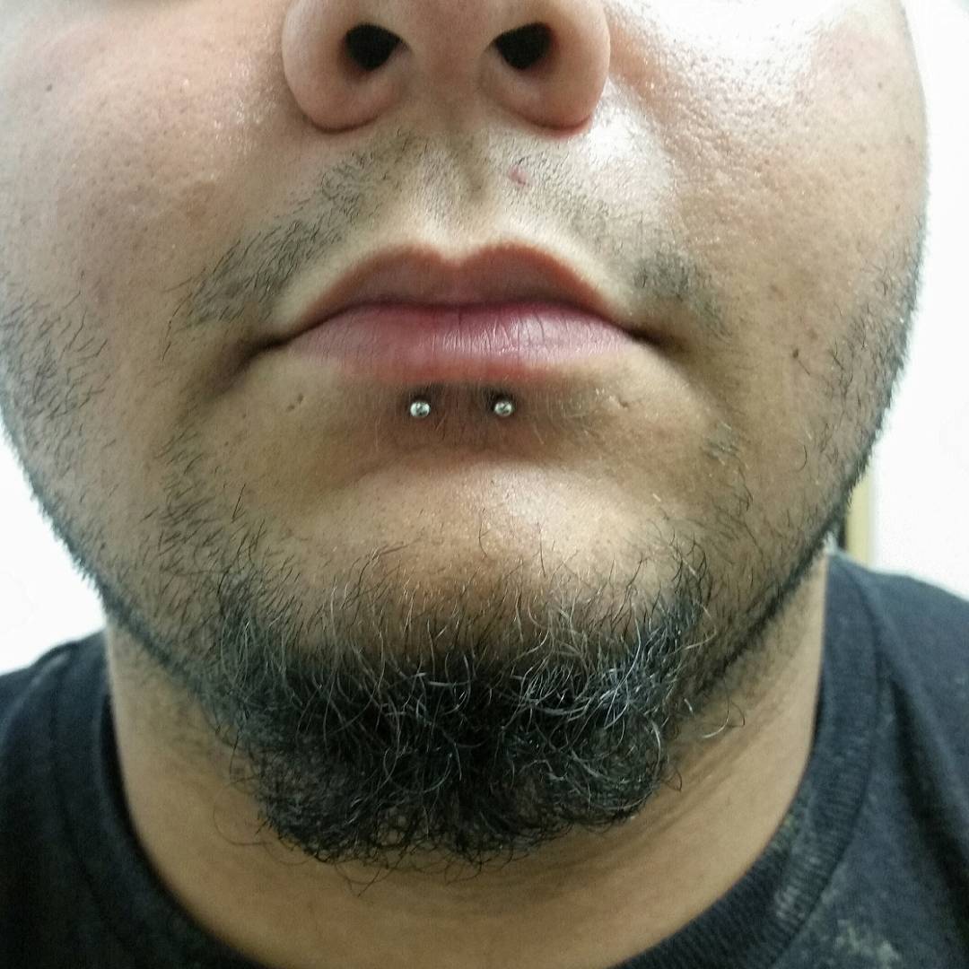 guy with dolphin bites piercing
