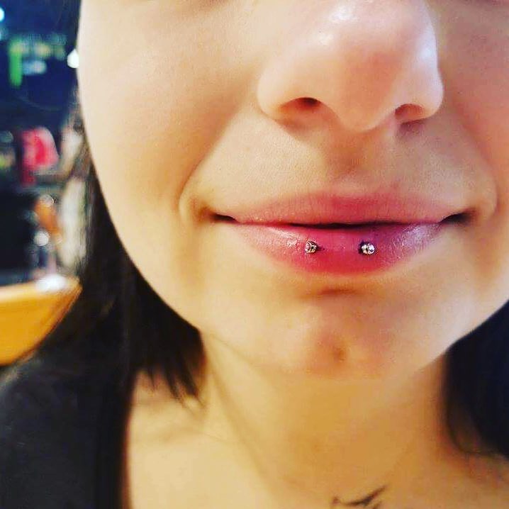 small and pretty horizontal lip piercing
