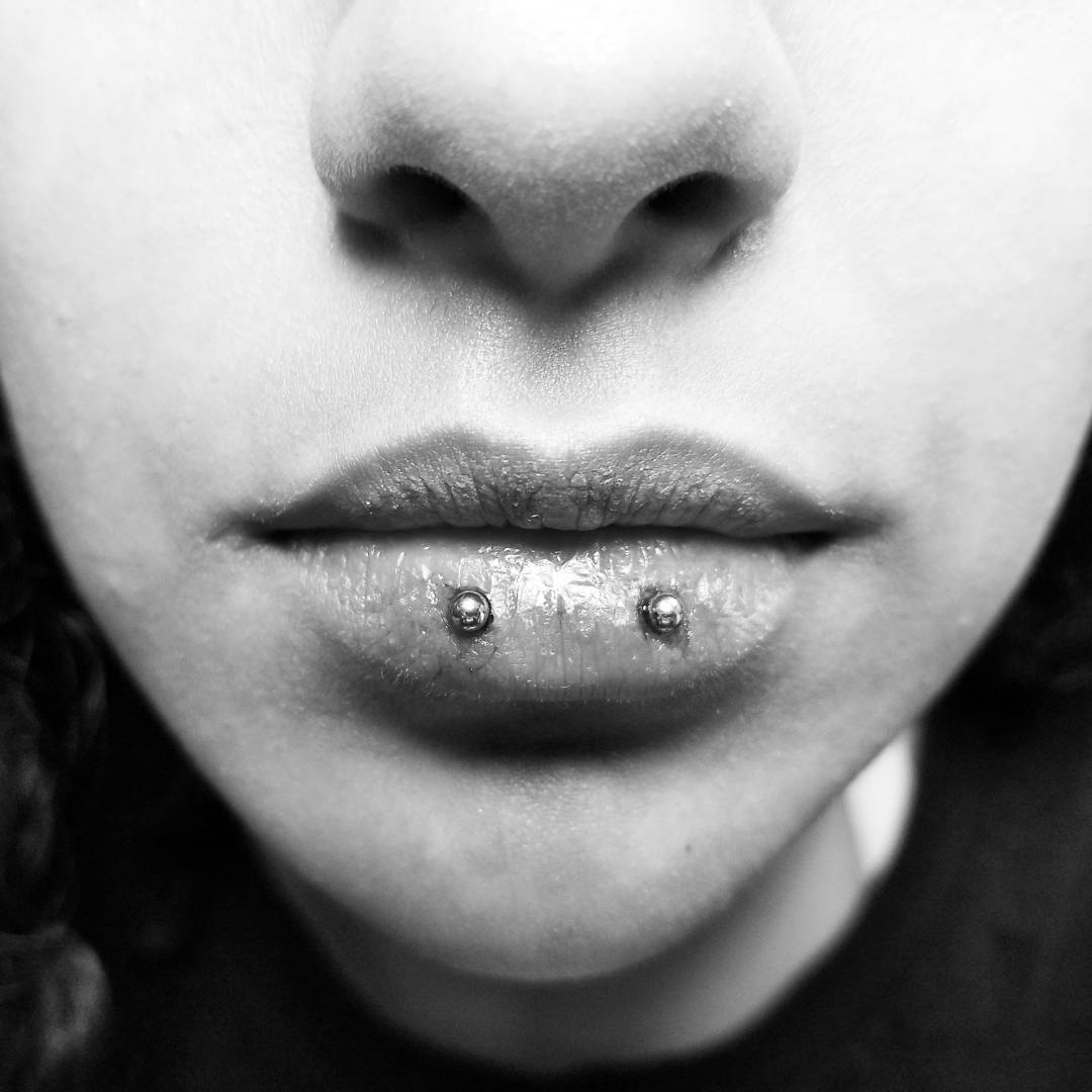 horizontal lip piercing scar