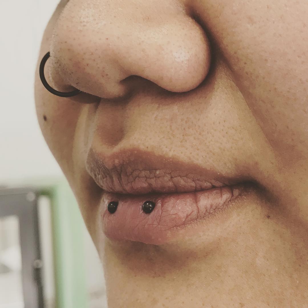 horizontal lip piercing black jewelry